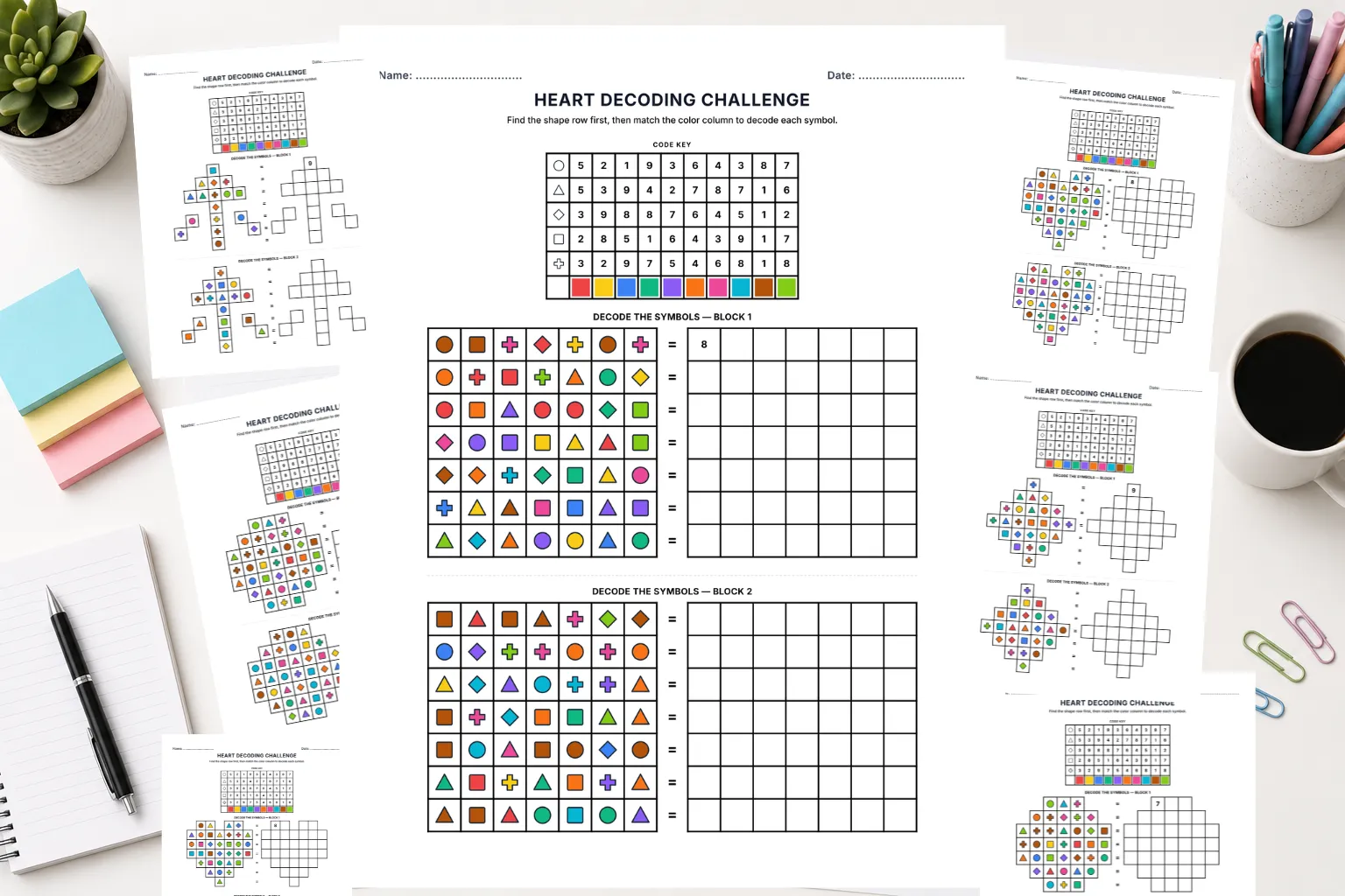 Flat lay of printed SymboliQ worksheets with star, heart, and diamond frame shapes